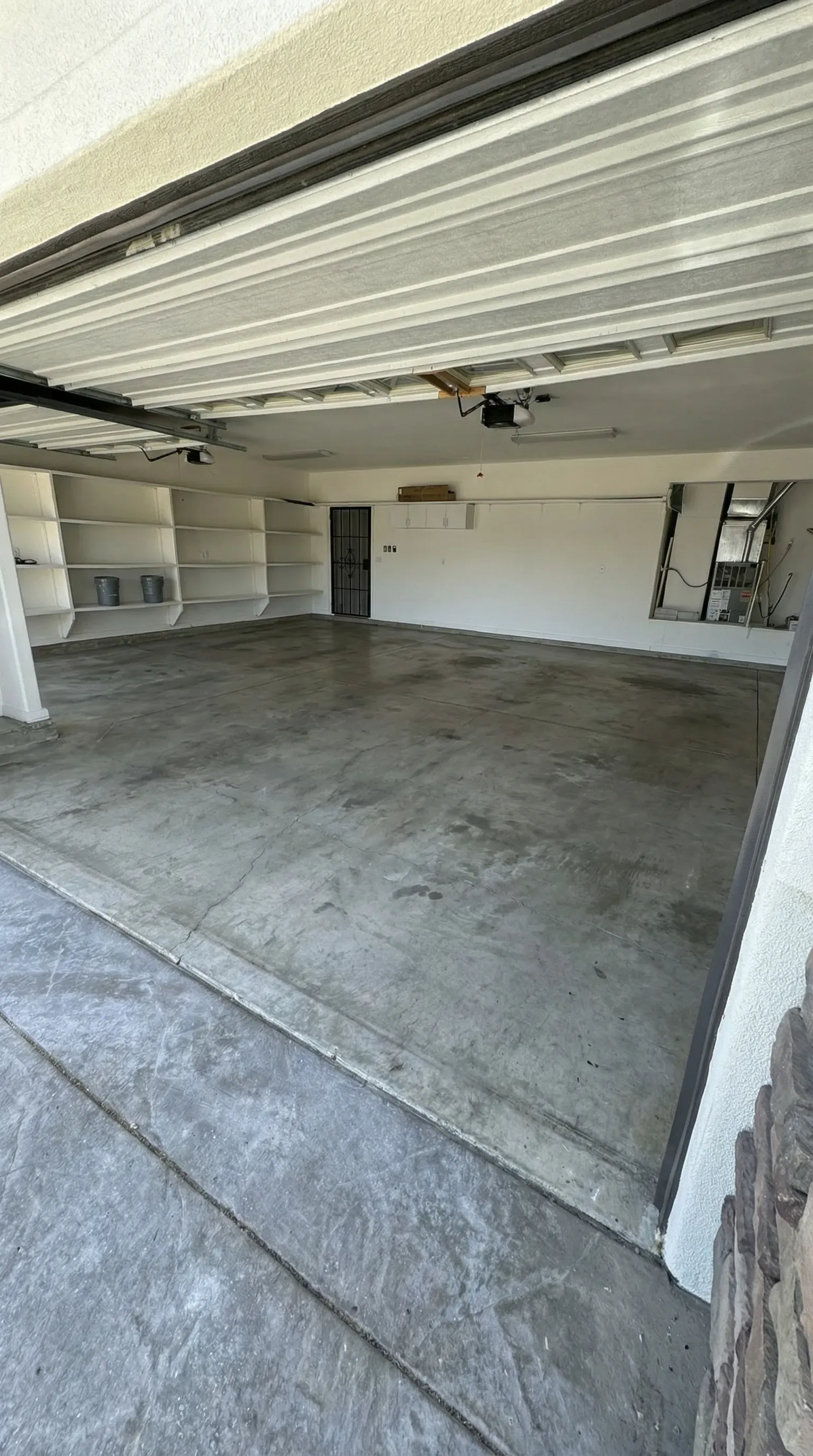 Raw concrete garage floor before ProFlake epoxy installation